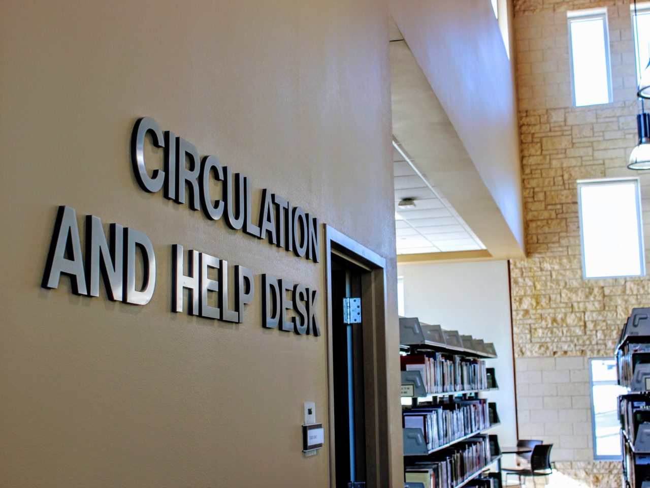 Letters on painted wall in Library read "Circulation Desk"