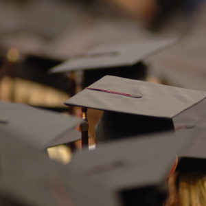 Closeup of students wearing graduation caps
