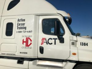 White truck with Howard College and ACT logos